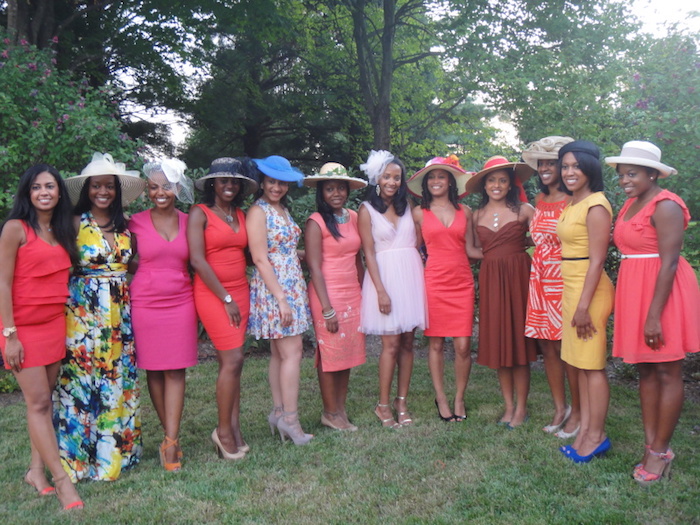 smiling women in different summer dresses, knee-length and longer, red and pink, multicolored and patterned, semi formal dress code, wearing high heels in different colors