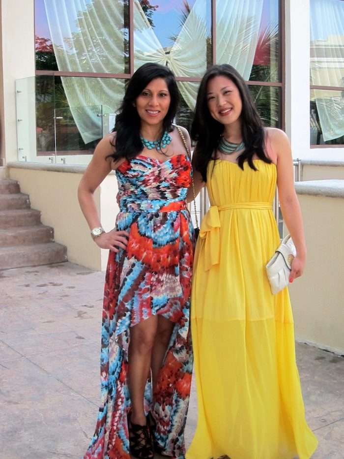 multicolored asymmetrical maxi dress, worn with black lace up sandals, and turquoise chunky necklace, what is semi formal attire, floaty yellow gown