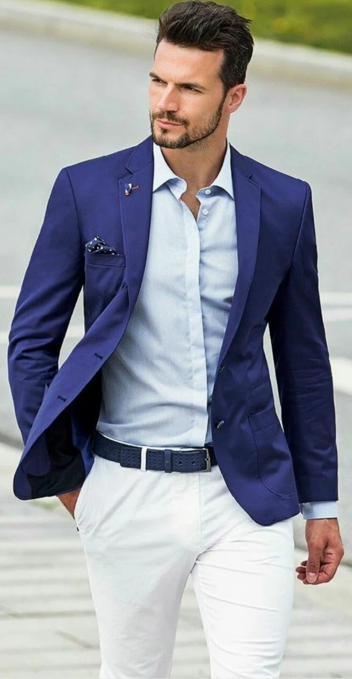 pocket handkerchief in blue, with white polka dots, worn by man in dark blue blazer, what is cocktail attire for men, pale blue shirt, white trousers with dark blue belt