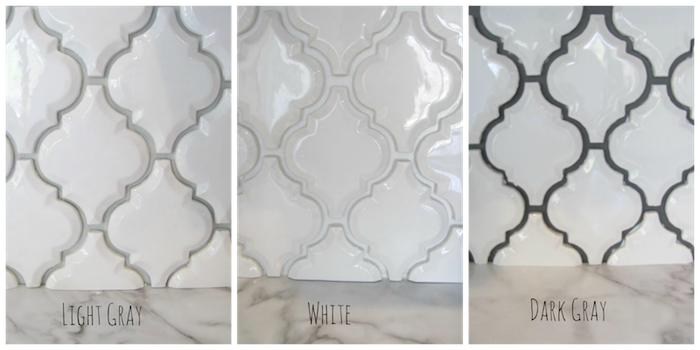 three examples of a white, arabesque tile backsplash, with joints in light grey, white or dark grey, near a smooth marble surface