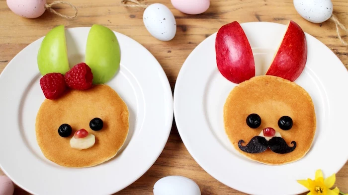 pancakes decorated with fresh fruit, and made to look like bunny faces, simple breakfast ideas, green and red apple slices, blueberries and banana slices, raspberries and pomegranate seeds