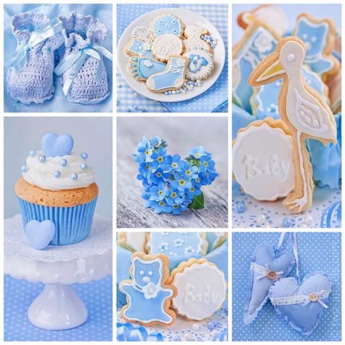cookies decorated with pale blue and white frosting, little knitted baby booties in light lavender, forget-me-nots and a cupcake