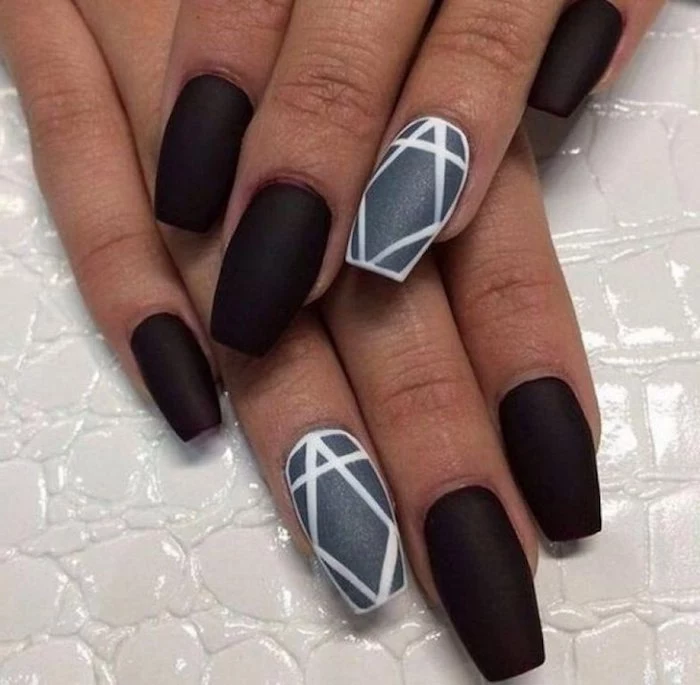 velvet-like black matte coffin nails, with a grey ring-finger nail, decorated with a white diamond-shape, a white outline and stripe