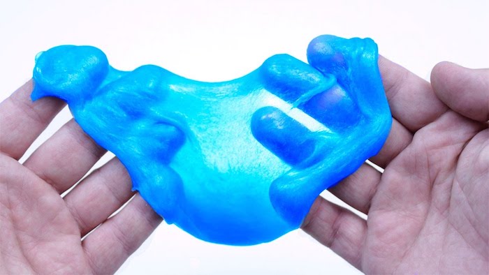 semi-sheer bright blue goo, held and stretched, by a pair of adult's hands, pure white background, how to make slime without borax 