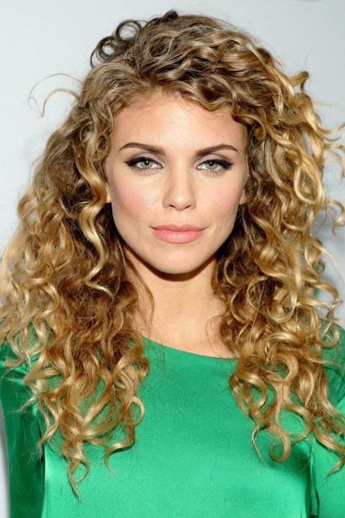 silky and shiny green top, worn by blonde woman, with green eyes, wearing black eyeliner, and pale pink lipstick, long curly hairstyles, with highlights and side part