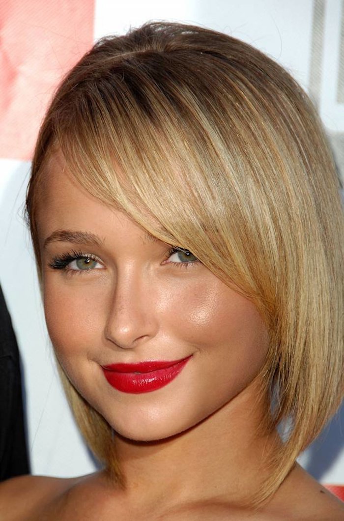 vivid red lipstick, worn by hayden panettiere, with fake lashes, short hairstyles for fine hair, asymmetrical blonde bob, with side bangs, and dark blonde roots