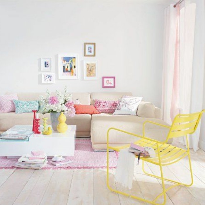 yellow chair inside a bright room, decorated with pastel colors, how to decorate a living room, containing a beige corner sofa, with multicolored cushions