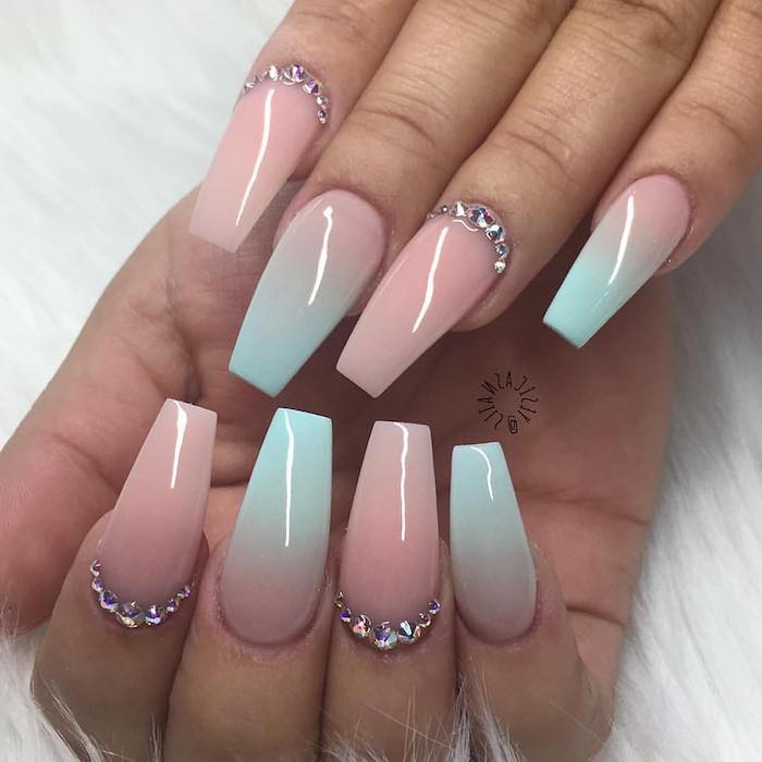 oval nails with square tips, painted in pale bastel pink, and baby blue nail polish, with ombre-effect, and rhinestone details
