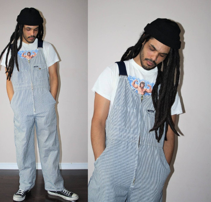 dreadlocks in dark brown, worn by a man with a black beanie hat, 90s aesthetic, a white t-shirt with colorful print, and pinstriped overalls