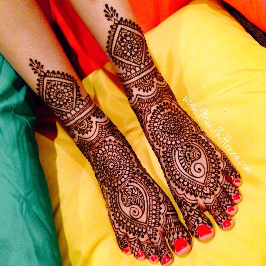 traditional wedding mehndi, elaborate dark brown, henna foot tattoo, on the feet and ankles of two legs