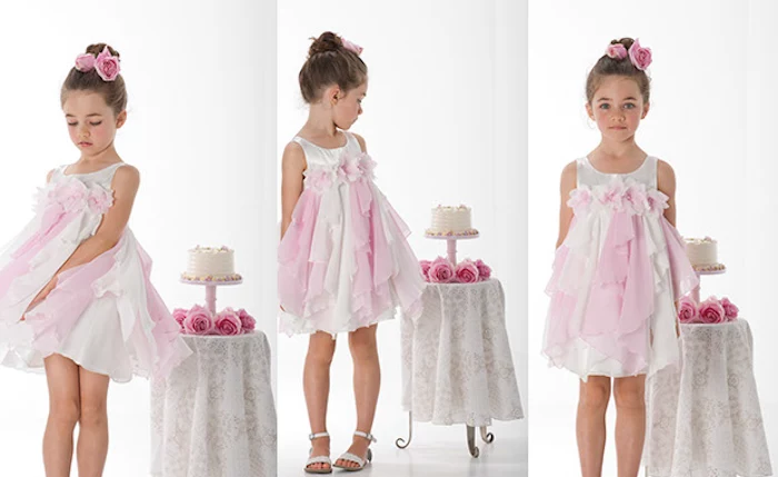 party dress in pink and white, worn by a young girl, with brunette hair, tied in a top knot, and decorated with pink roses, table with cake, and more roses nearby