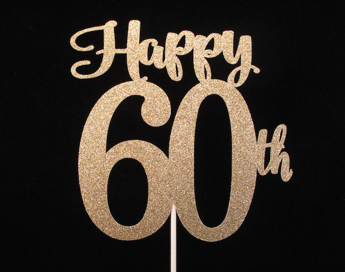 Cake Topper In A Sparkly Gold Color With The Words Happy 60th On A Black Background Happy 60th Birthday Seen In Close Up 