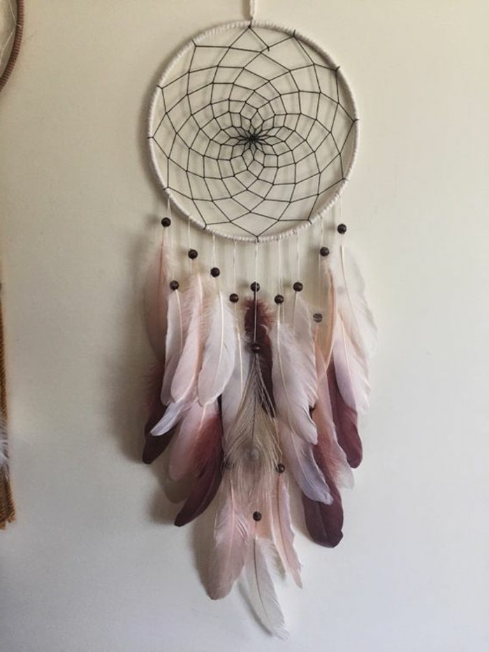 pictures of dream catchers, classic dream catcher in white, with black net, decorated with pale pink, dark purple and white feathers, and small black beads