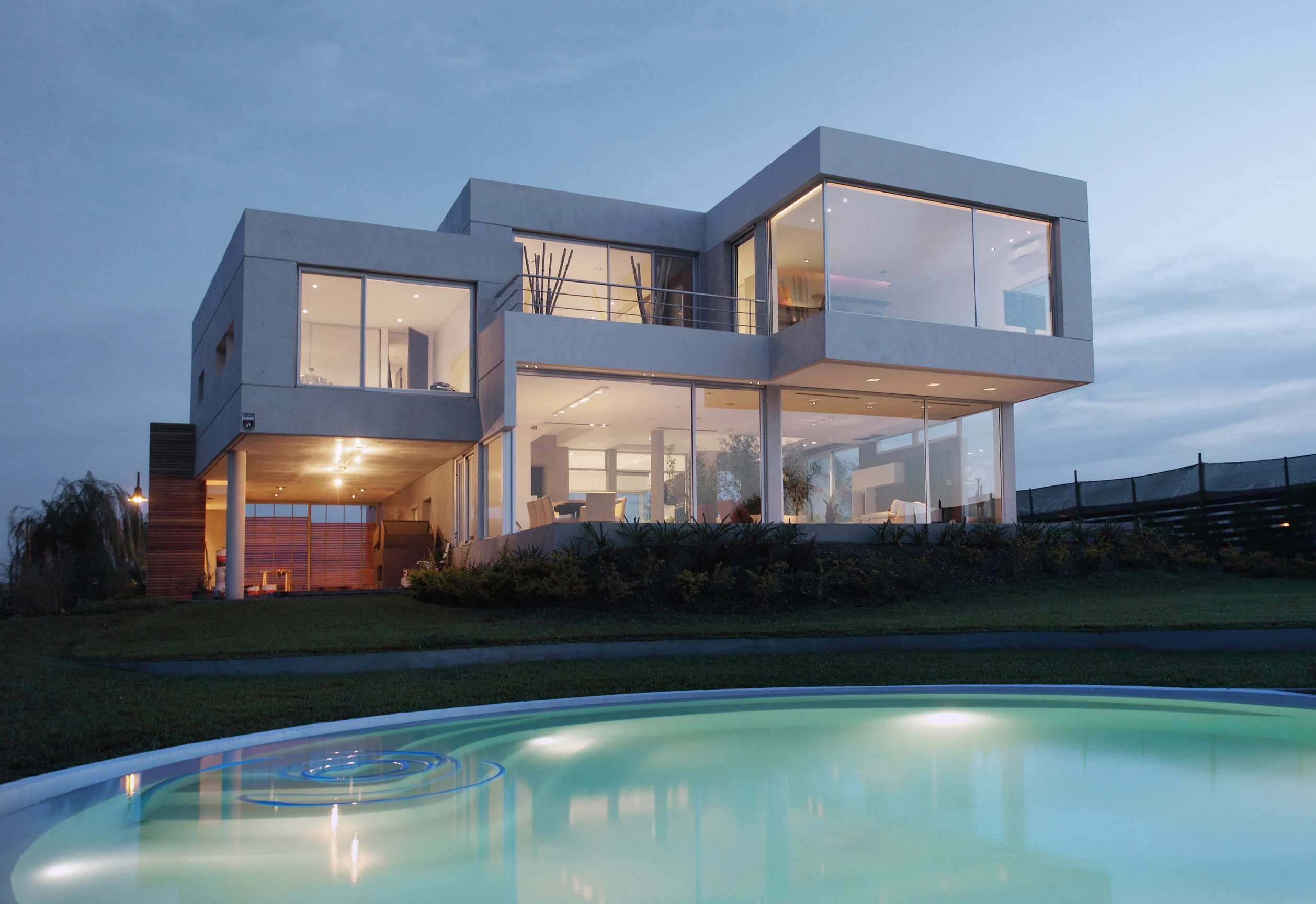 cube-shaped structures, with large windows, and white panelling, forming a house, postmodern architecture, near a blue swimming pool 