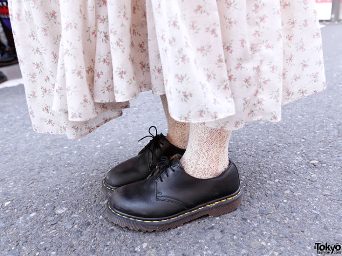 lace sheer white socks, worn with chunky heeled, black lace-up shoes, and a cream midi skirt, with pale floral pattern