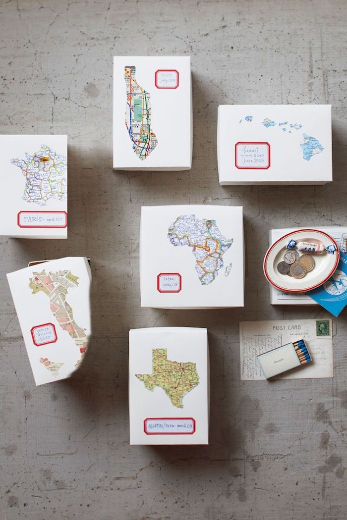 white carton boxes, personalised with maps of different countries and states, diy gifts for friends, arranged on grey surface