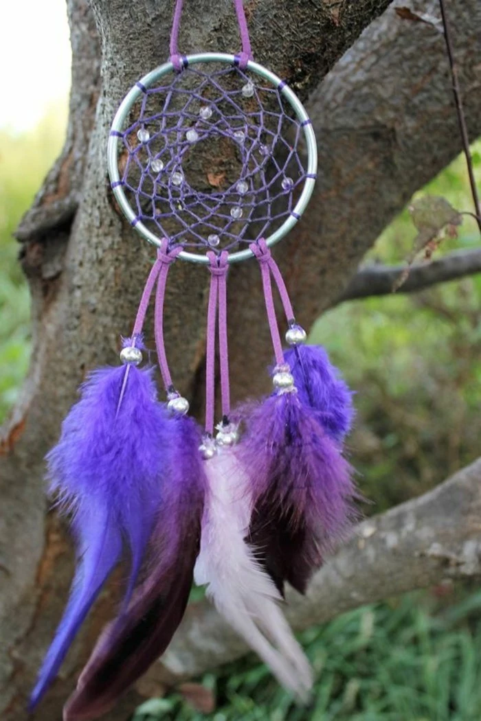 purple and violet, and pale pink feathers, attached to a small hoop, with purple woven net, and pale beads, diy dreamcatcher 
