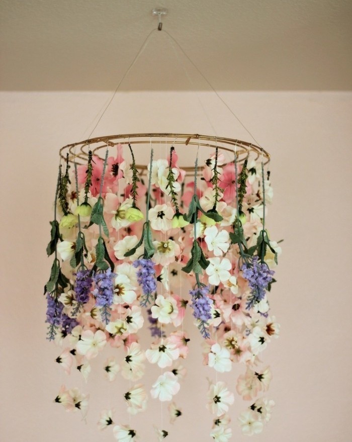 hanging round ornament, decorated with faux flowers, in different shapes and colors, inexpensive thank you gift ideas, suspended from the ceiling on a string