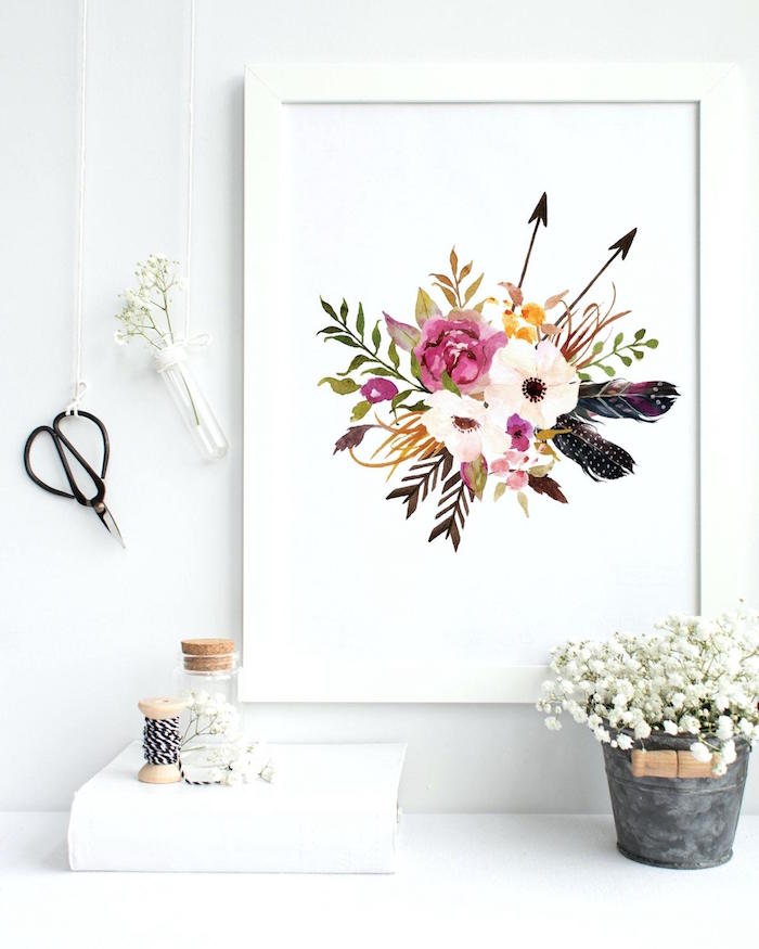 small bathroom decorating ideas, close-up of a flower drawing, in a white frame, mounted on a white wall, decorated with a pair of vintage scissors, and a small vial, containing a white flower, hanging from a white string, little bucket filled with white flowers