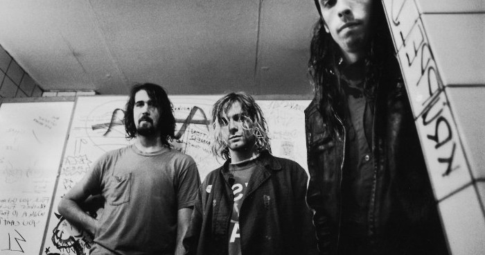 nirvana members in a black and white image, 90s aesthetic, kurt cobain and dave grohl, with krist novoselic, grunge style icons
