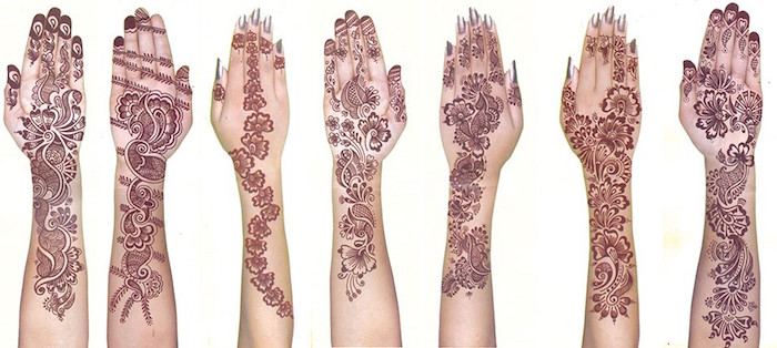 seven outstretched arms, decorated with different henna patterns, flowers and paisleys, symmetrical shapes and flourishes, painted on the forearm and palm
