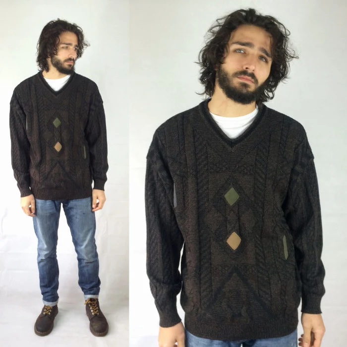 v-neck oversized knitted sweater, with beige and green details, 90s party outfits for guys, worn by curly brunette man, with jeans and worker's boots