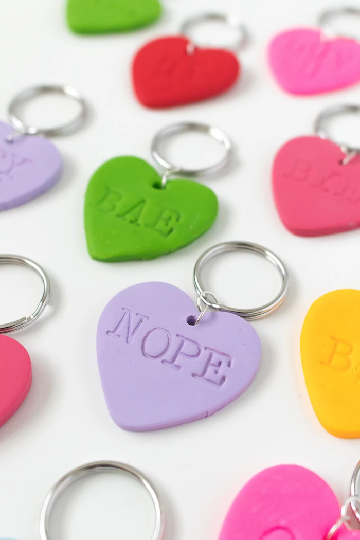 heart shaped keychains, made of fimo leather, best friend gifts diy, personalised wording on them, white background