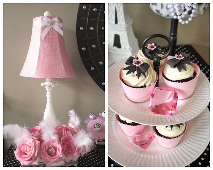 close up of a dish on two levels, with several cupcakes, and pink gem decorations, 60th birthday party ideas for mom, next image shows a lamp, with a pink lampshade, with feathers and pink roses