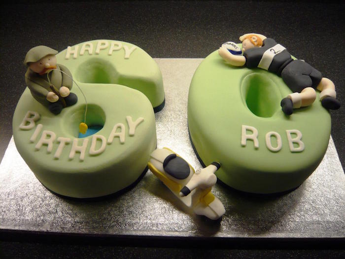 two piece cake, shaped like a 6 and a 0, covered in light green fondant, and decorated with 3 small shapes, happy 60th birthday, fishing man and footballer, tiny cream and black scooter
