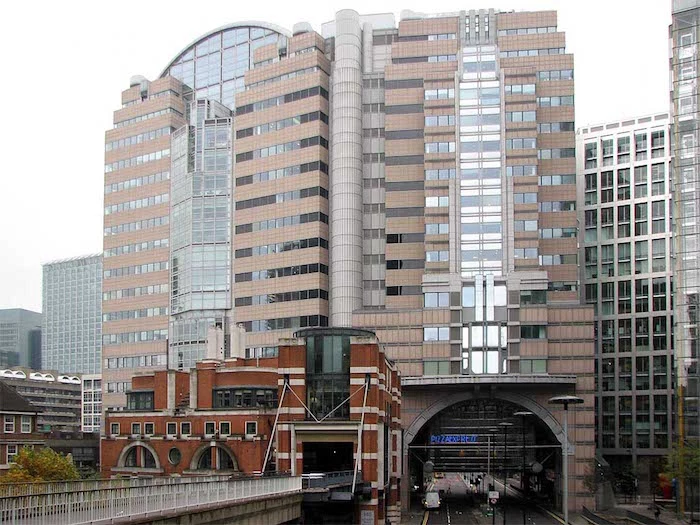 angular and round elements, incorporated in a large building, with lots of glass segments, postmodern buildings in london