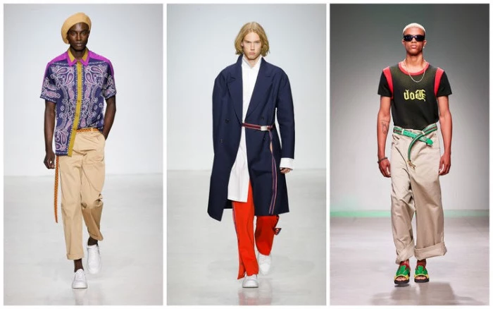 colorful 90s party outfits for guys, three male models on a catwalk, beige trousers and a purple shirt, oversized navy coat and red trousers, olive green and red tee
