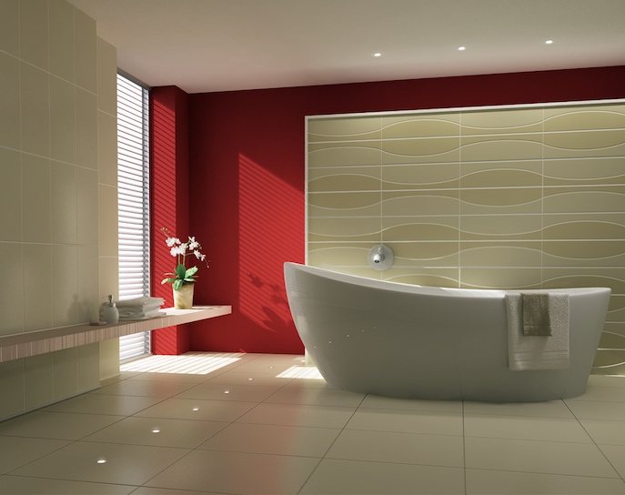 modern bathroom ideas, red and cream walls, in a sunlit room, containing a modern oval white bathtub, a potted plant and folded towels, and an off-white tiled floor