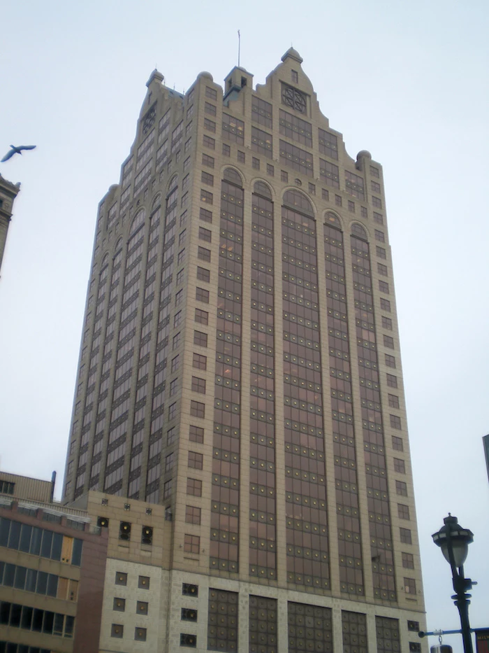 tower-like skyscraper, in different shades of brown, decorated with arches, and elements inspired from classic architecture, postmodern buildings in wisconsin 