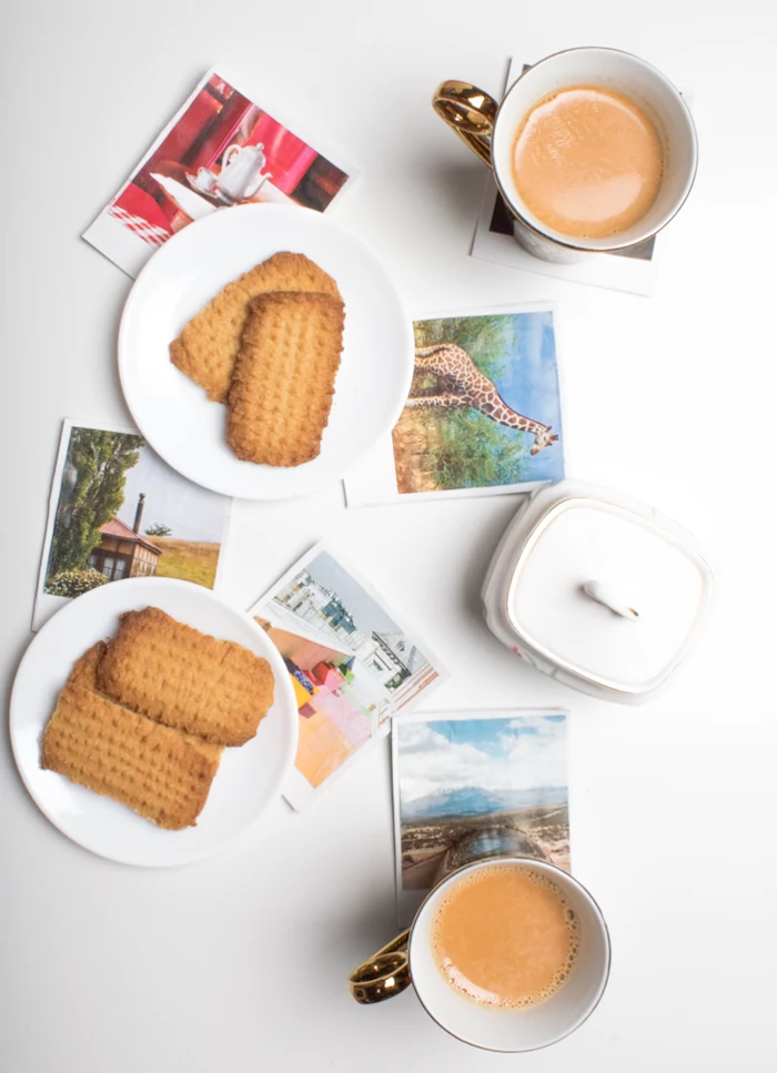 photos of nature and animals, placed on a white surface, white plates with cookies and coffee mugs, best friend gifts diy
