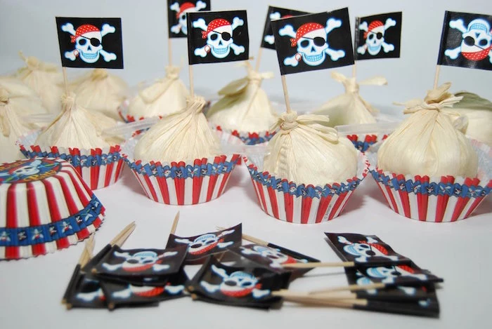 sweets in white, red and blue wrappers, each decorated with a small black flag, bearing a pirate's logo