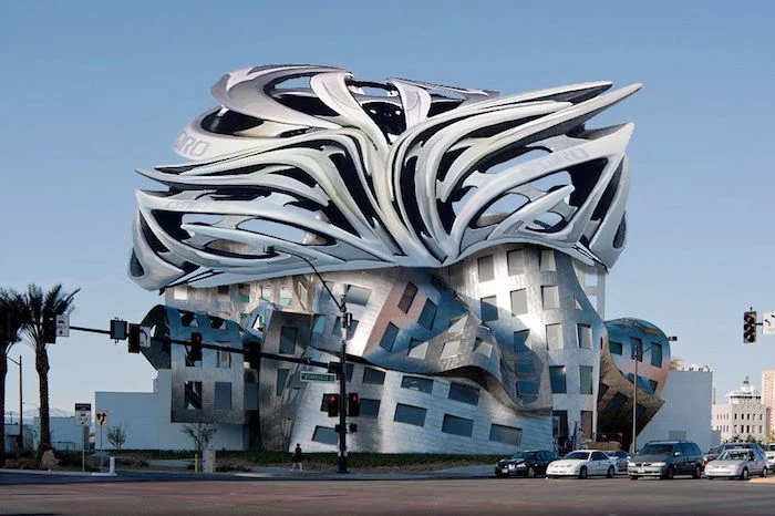 postmodern design, abstract metal-look building, with a molten-effect roof, and a bottom part that looks twisted or folded, vertical and horizontal windows
