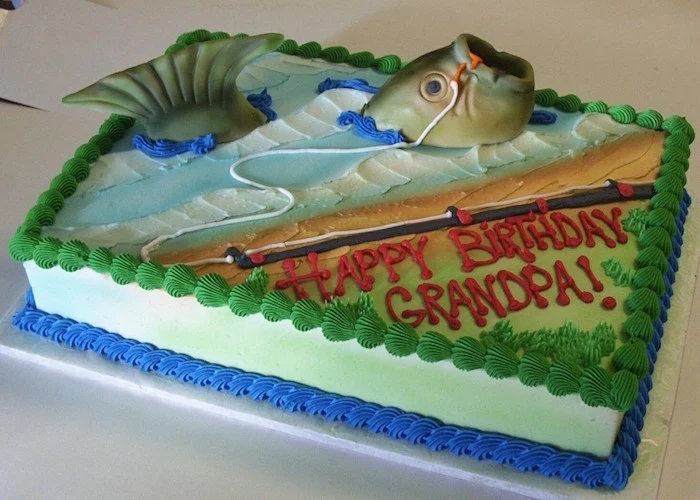 fish attached to a fishing pole, decorating a rectangular birthday cake, in pale blue green and orange, 60th birthday ideas, happy birthday grandpa, written in red frosting