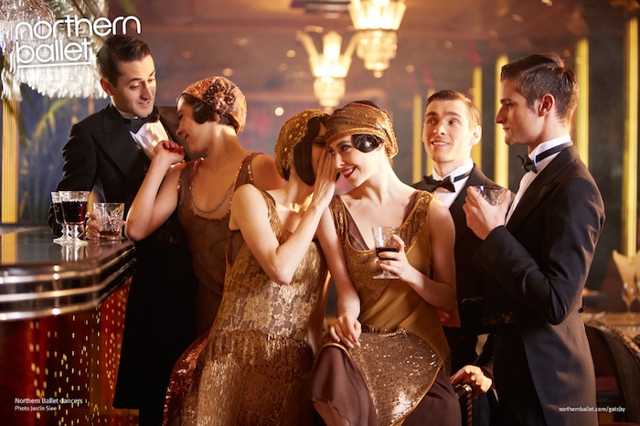 bar decorated in 1920s art deco style, with three women in flapper gowns, and three men in smockings, roaring 20s dress, and sequined hats