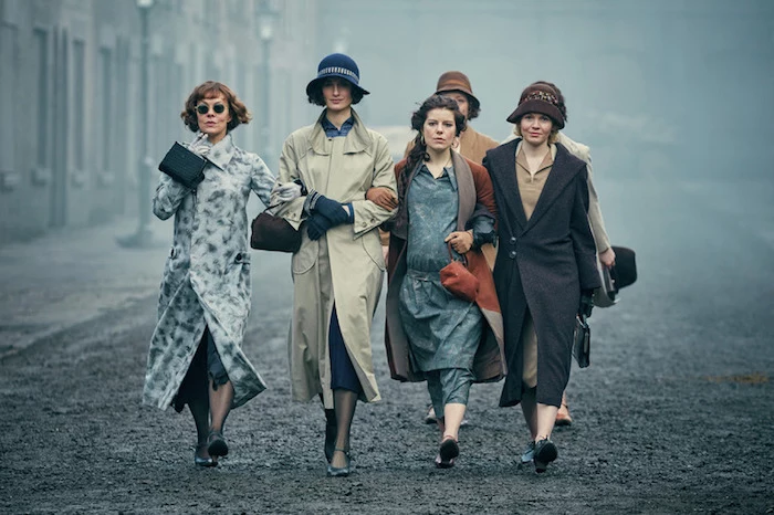 female characters from bbc's peaky blinders, wearing flapper-style attire, low-waisted dressed and wrap coats, roaring 20s dress ideas for parties