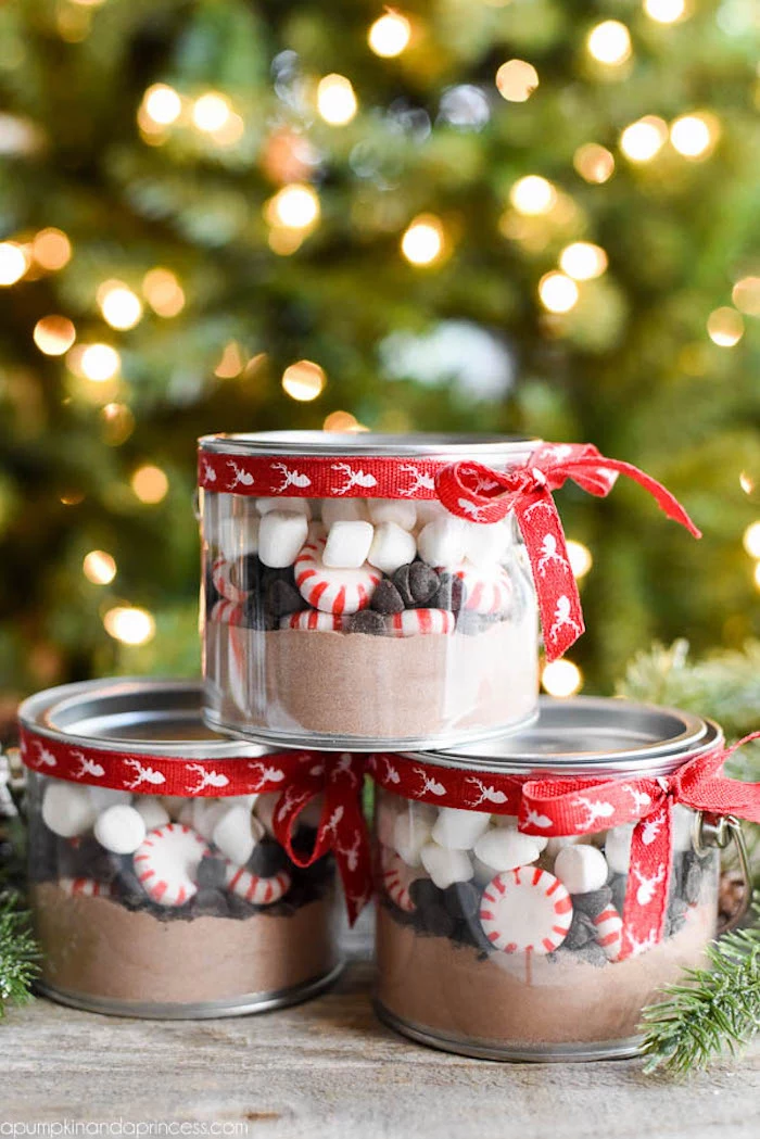 deconstructed hot chocolate inside small jars, thoughtful christmas gifts, decorated with red ribbon around the lid