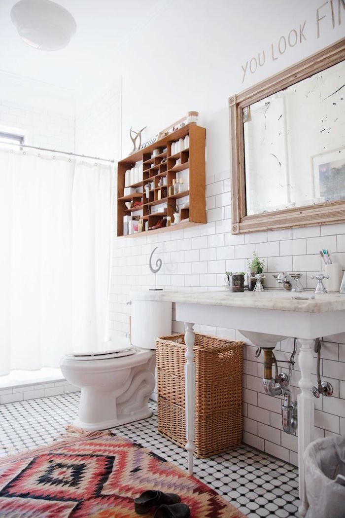 rug with an aztec red and black pattern, diy bathroom décor, in a bright room, containing a shower area, with a white curtain, a marble sink, a toilet bowl, and a large mirror