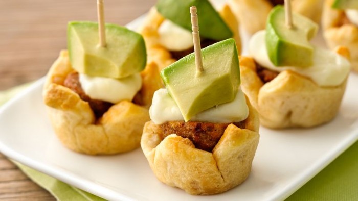 edible tiny baskets, filled with meatballs, and topped with a white sauce, and avocado pieces, hors d oeuvres recipes, for parties or dinners