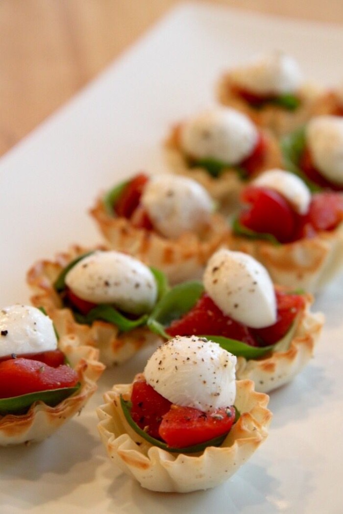 tartlets stuffed with chopped tomato, fresh basil leaves, and mozzarella sprinkled with pepper, horderves ideas, for special occasions