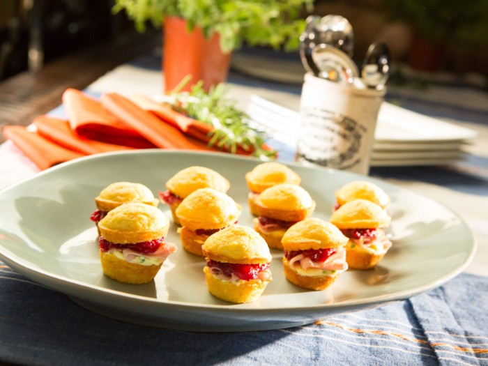 sandwich bites with ham, cream cheese and stuffing, on a large round plate, hour derves for special events