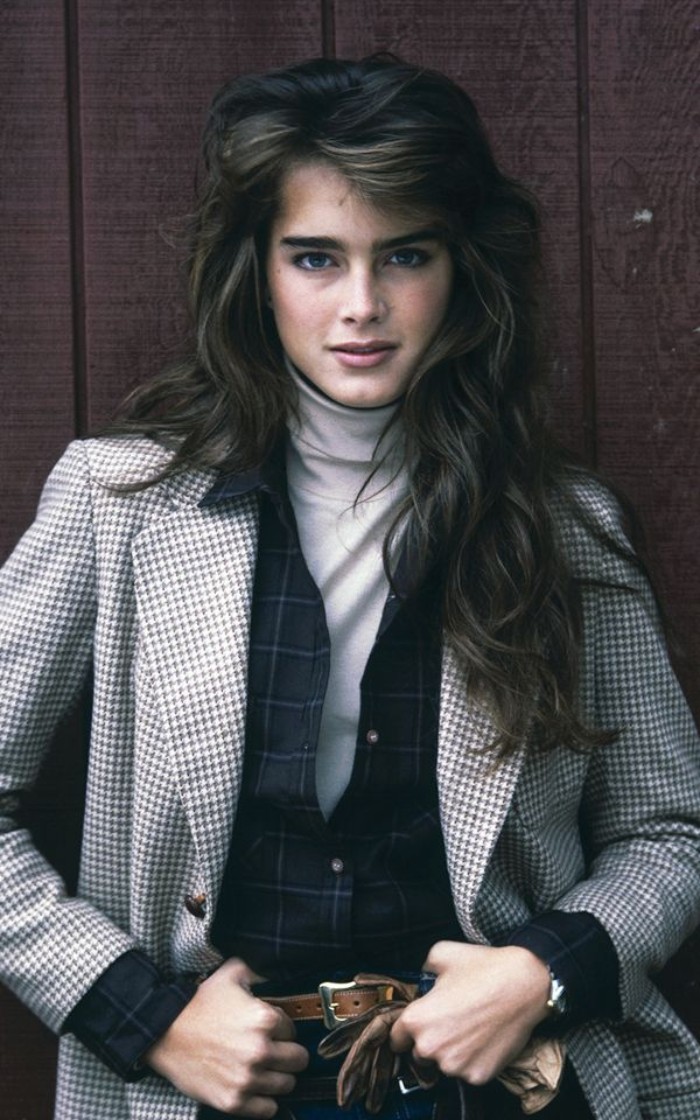 off-white roll neck jumper, worn with a dark, navy blue checkered shirt, and a white and dark grey patterned coat, 80's dress up ideas, inspired by a young brooke shields