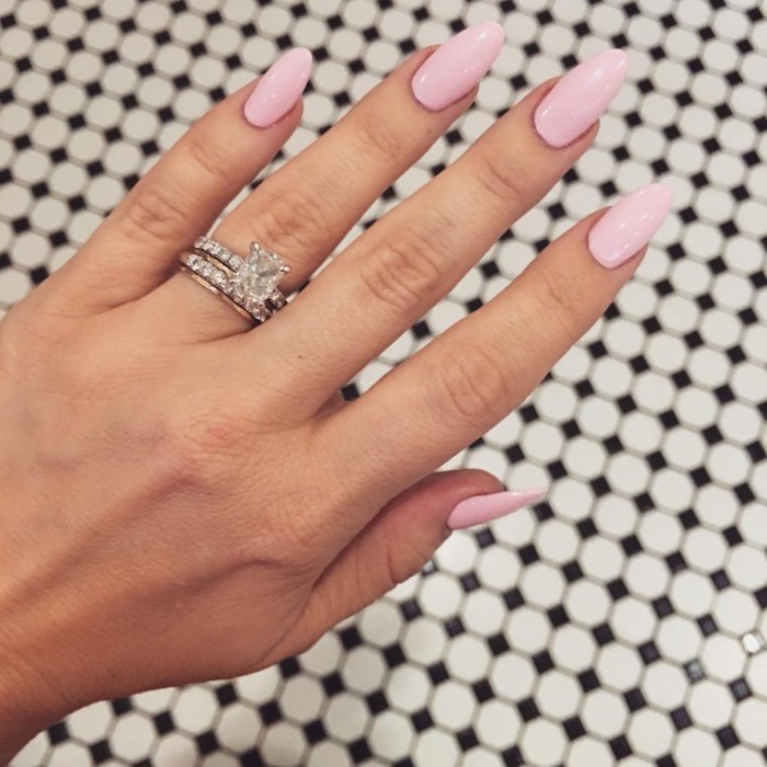 hot pink nails with diamonds on ring finger