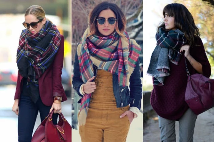 big patterned scarves, worn around the necks, of three women, two dressed in jeans, and one sporting beige corduroy overalls, how to fold a blanket scarf, in the winter