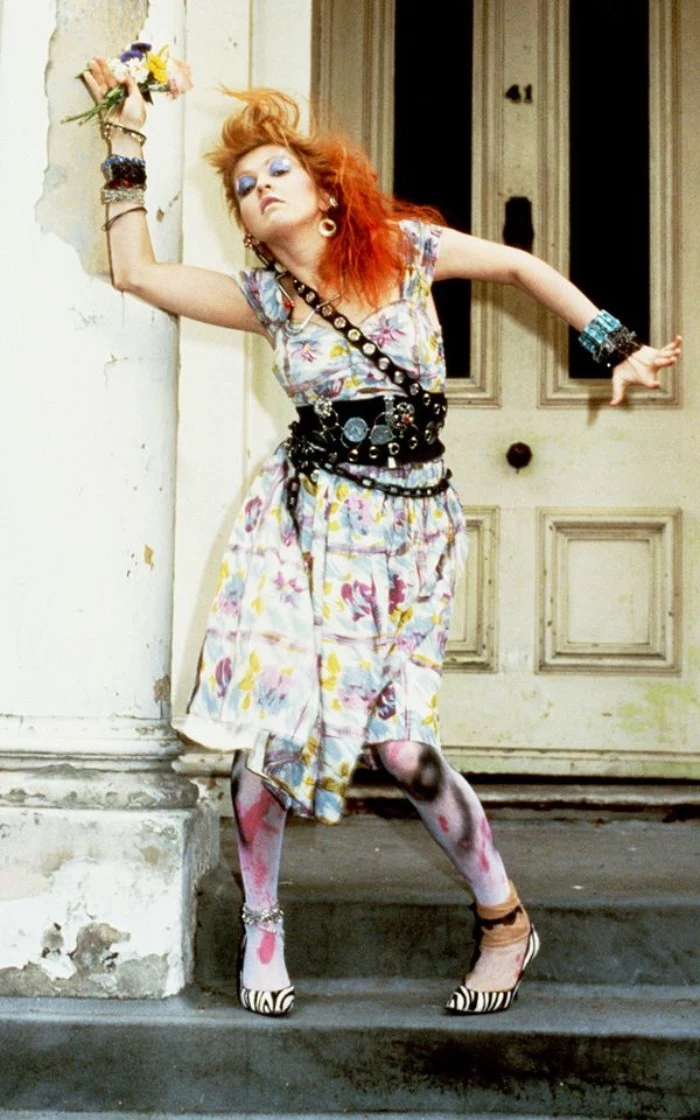 floral midi dress, in pale colors, worn with a studded black leather belt, and chain details, by cyndi lauper, tights with spray paint motifs, zebra print high heels