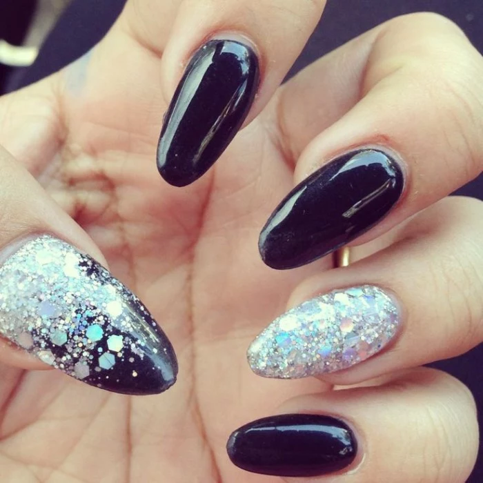 large iridescent glitter flakes, decorating a smooth manicure in black, almond nail designs, for acrylic nails 
