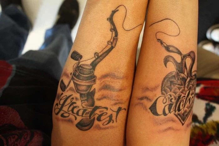 fishing rod with a hook, attached to a heart, with the inscription greatest catch, tattooed across two arms, placed next to each other, matching couple tattoos, done in black ink